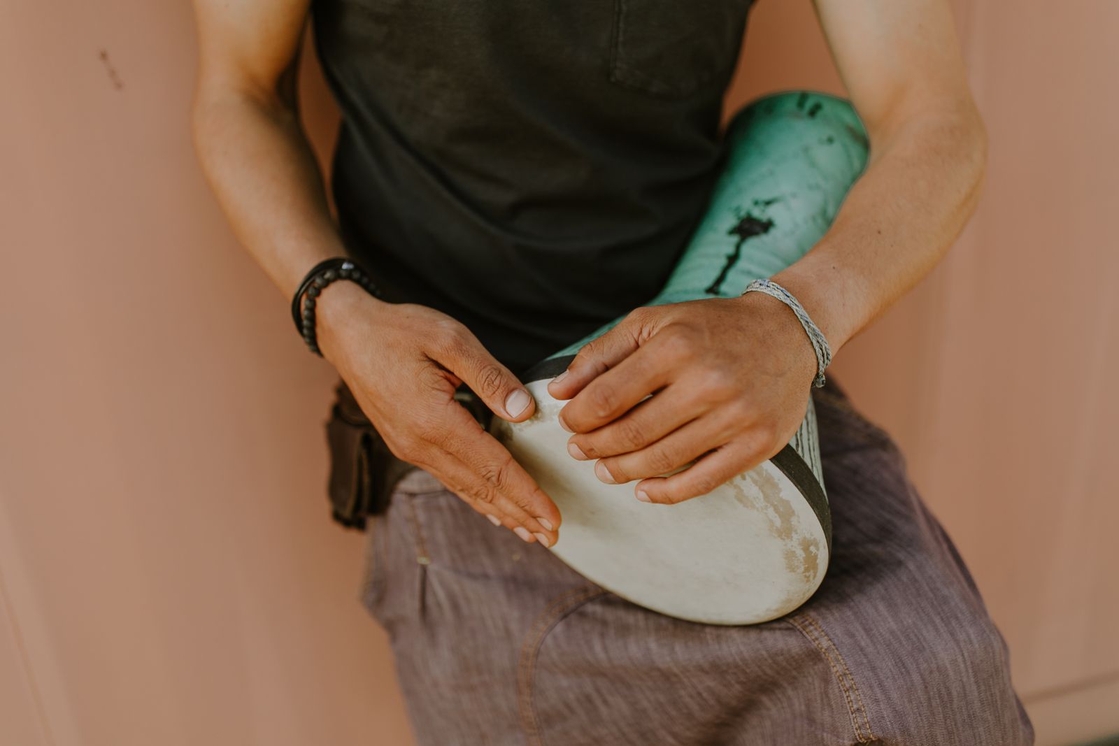 Hands on a goatskin drum